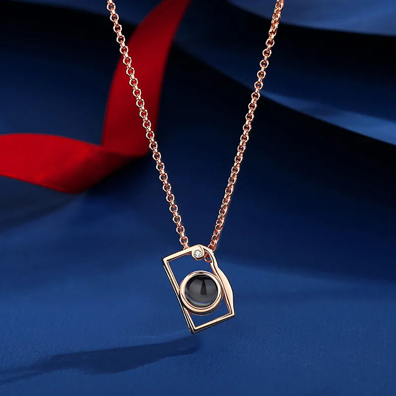 Camera Photo Projection Necklace showing personalized photo projection
