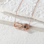 Close-up of infinity love photo projection necklace pendant