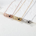 Close-up detail of the infinity love photo projection necklace